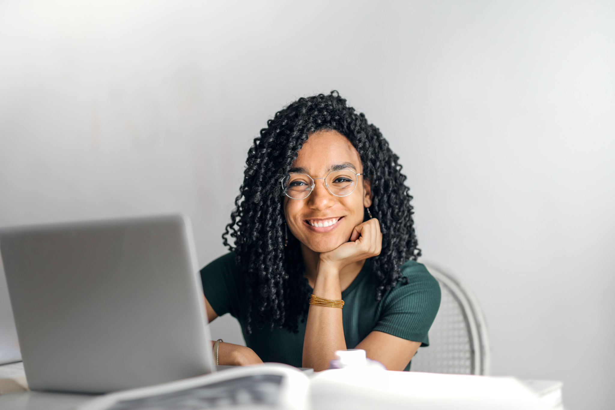 Professional woman smiling during a Zoom interview – Zoom interview tips with Playbook BD